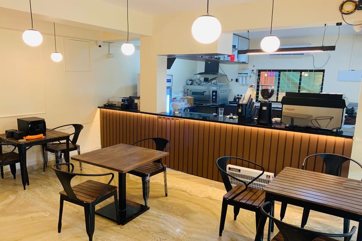 Coffee Koffein premium ambiance - elegant coffee shop design with warm lighting